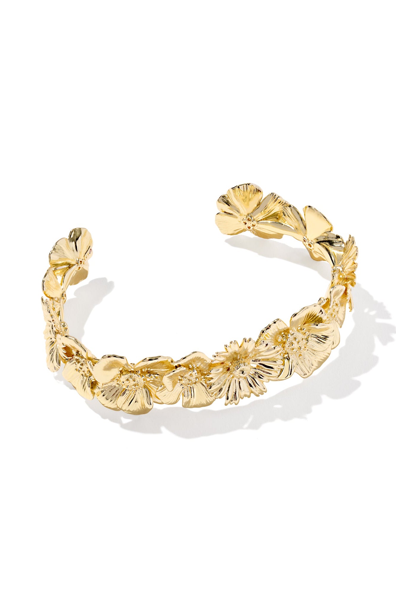 Gold bracelet with floral design on a white background